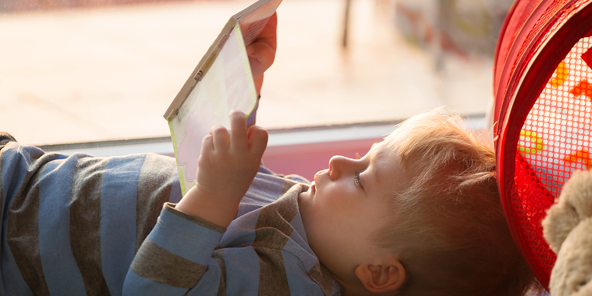 Little boy reading a book