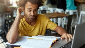 MAN CONFUSED WITH WORK