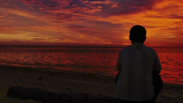 MAN WATCHING THE SUNSET