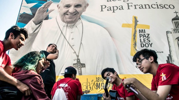 YOUTH AWAITING THE ARRIVAL OF THE POPE