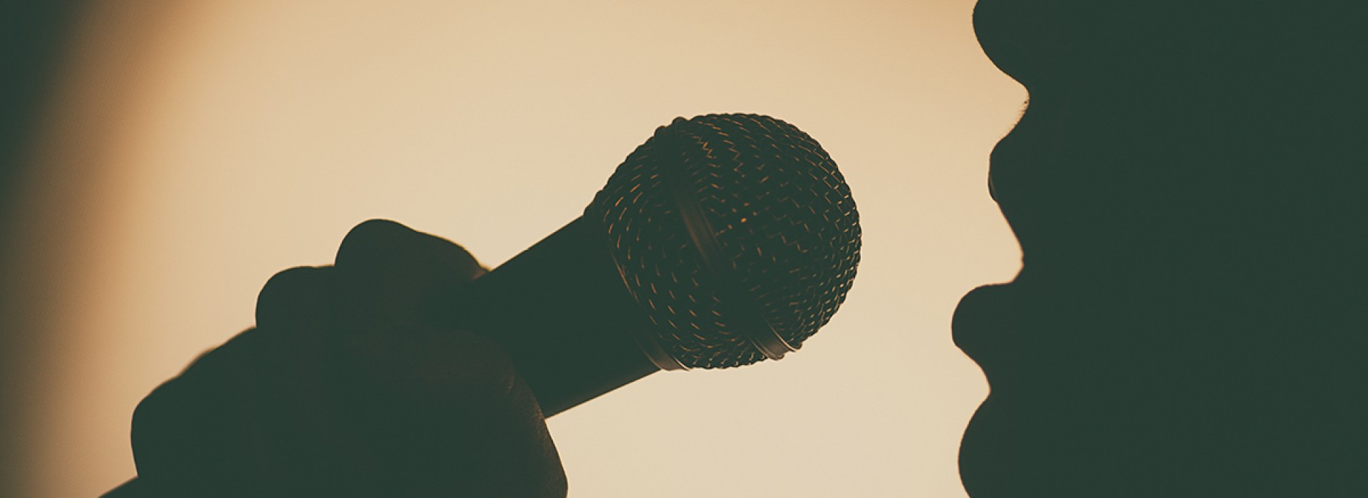 SINGING INTO MICROPHONE
