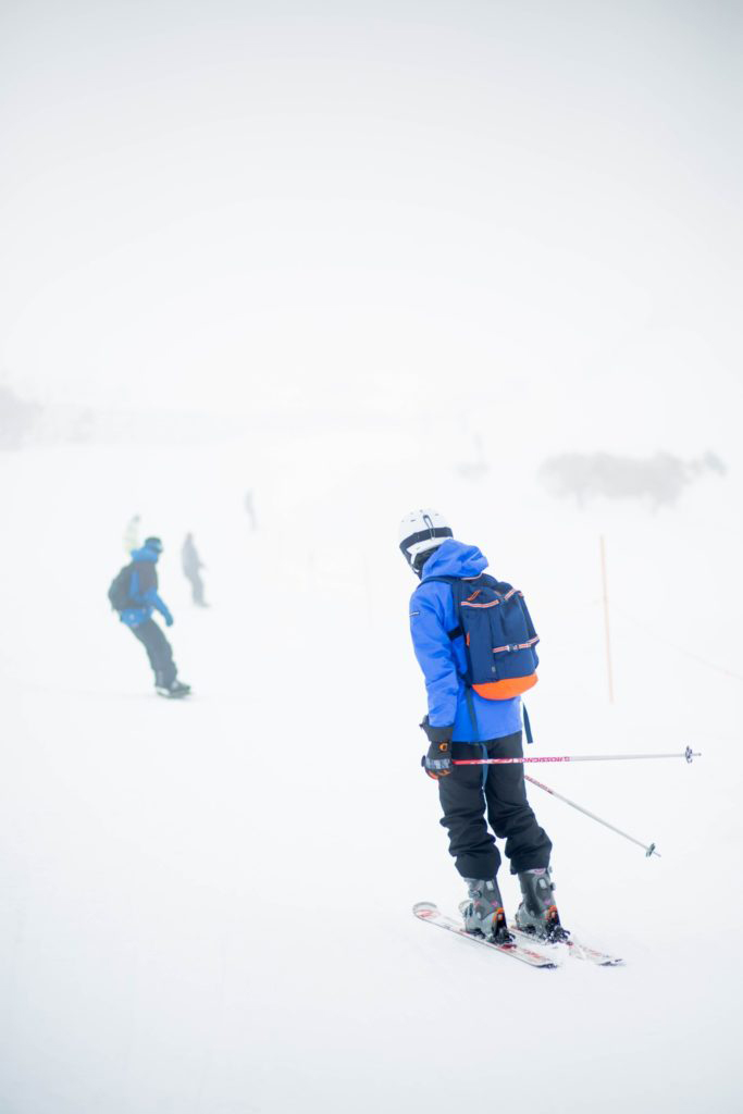 SKIERS ON A HILL