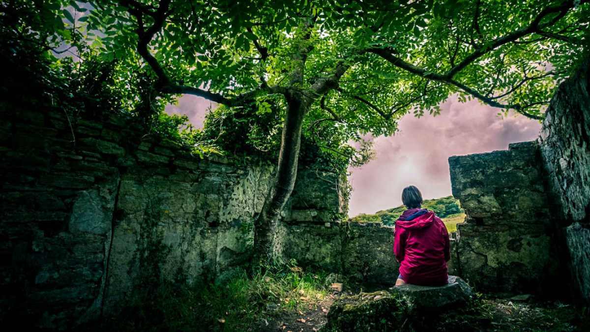 WOMAN SITTING ALONE