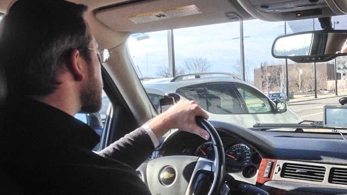 MAN DRIVING A CAR