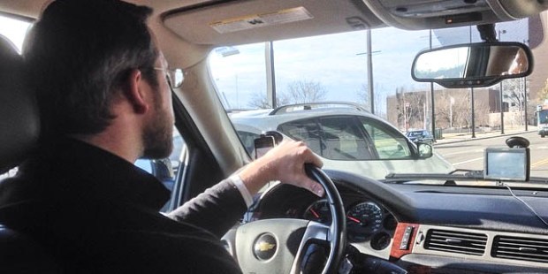 MAN DRIVING A CAR