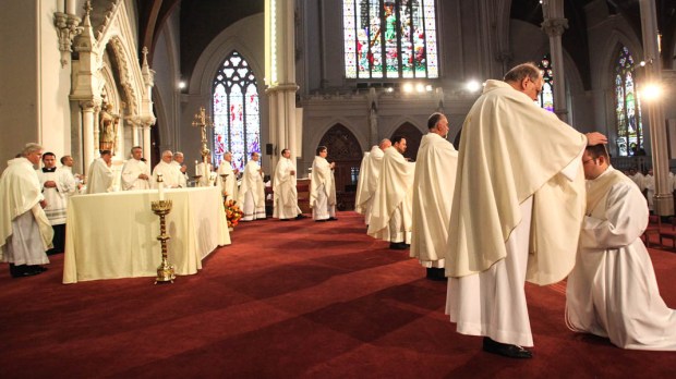 PRIEST BEING ORDAINED