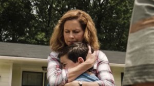 MOTHER HUGGING SON