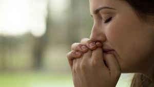 WOMAN PRAYING