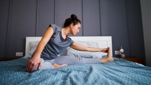 WOMAN,EXERCISE,BED