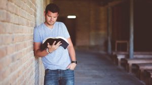 MAN READING BIBLE