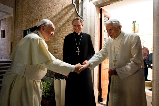 Pope Francis shaking hands with Pope Emeritus Benedict XVI 2 &#8211; pt