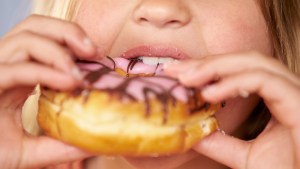 CHILD,EATING,DONUT