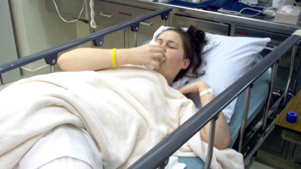 WOMAN IN HOSPITAL BED