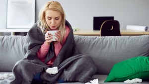 WOMAN,SICK,COUCH,TEA