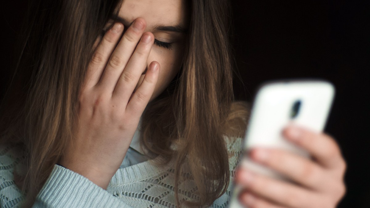 UPSET WOMAN ON PHONE