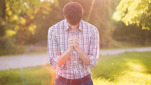 YOUNG,MAN,PRAYING