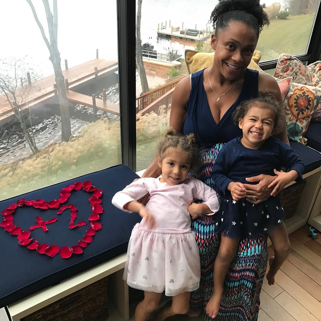 Dominique Dawes and with her two little twin daughters via Instagram