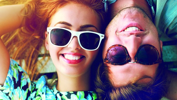Happy couple portraits wearing sunglasses