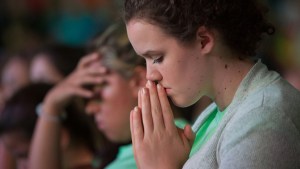 YOUNG,WOMAN,PRAYING