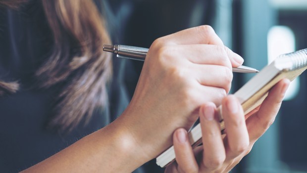 Woman writing notes