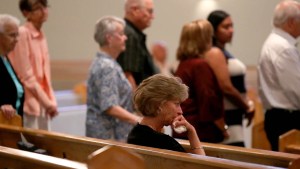 COMMUNION LINE,WOMAN SITTING IN PEW