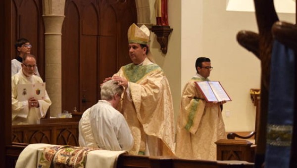 PRIEST BEING ORDAINED