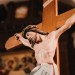 Why do Catholics use crucifixes with Jesus on the cross?