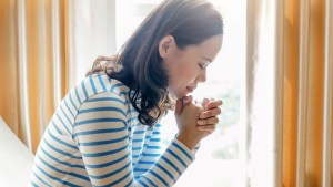 WOMAN PRAYING