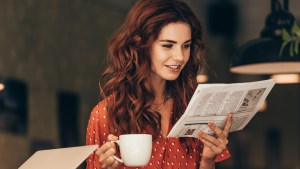 WOMAN,NEWSPAPER