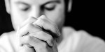 MAN PRAYING