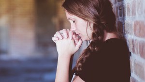 WOMAN PRAYING