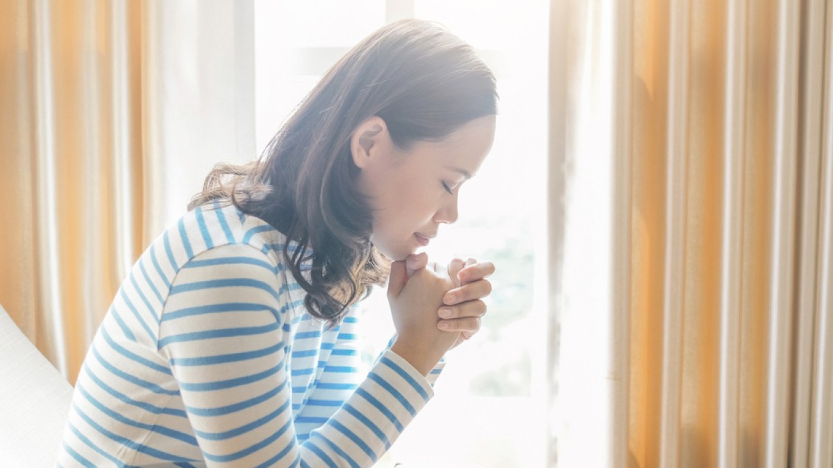 WOMAN PRAYING
