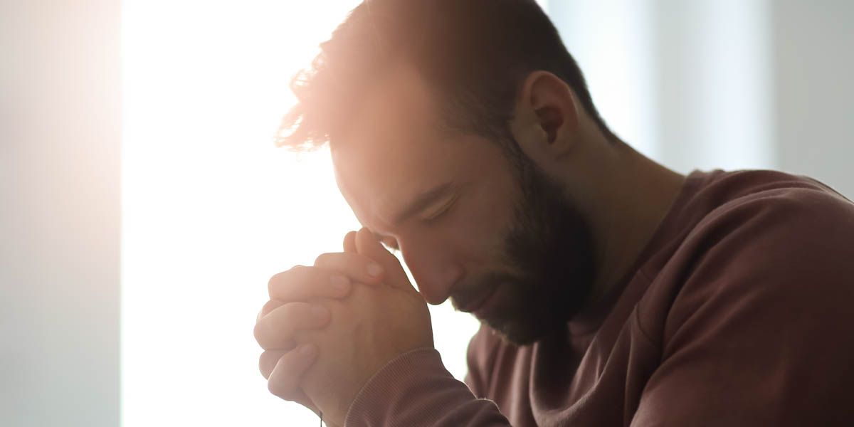 MAN PRAYING