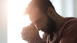 MAN PRAYING