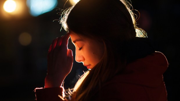 WOMAN PRAYING