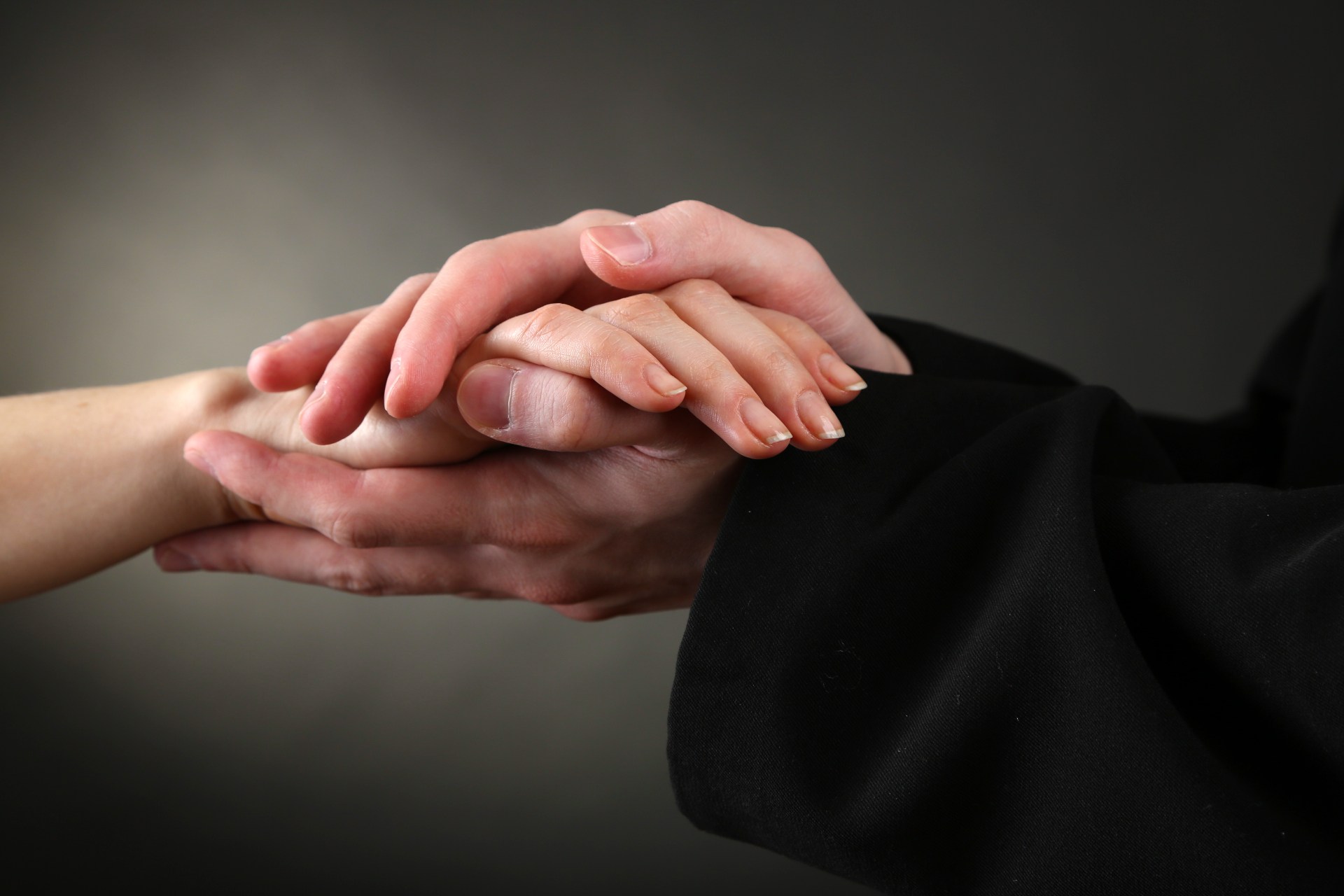 WEB3-priest-woman-touch-hands