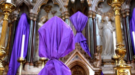 Why do Catholics cover crucifixes and statues during Lent?