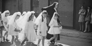 Why do girls wear veils at their First Communion?