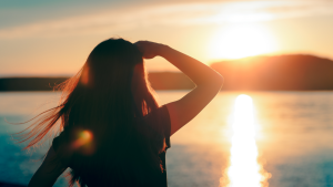 woman looking at the sunset