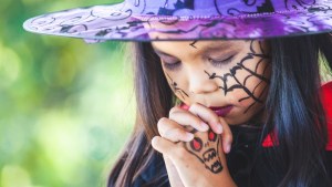 web3-halloween-little-girl-costume-witch-praying-celebration-a3pfamily-shutterstock.jpg