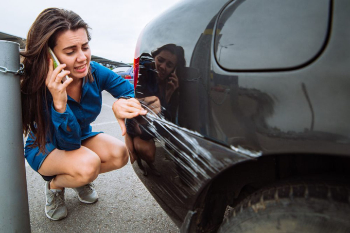 web-05-woman-scratched-car-call-shutterstock-1065234551-vera-petrunina.jpg