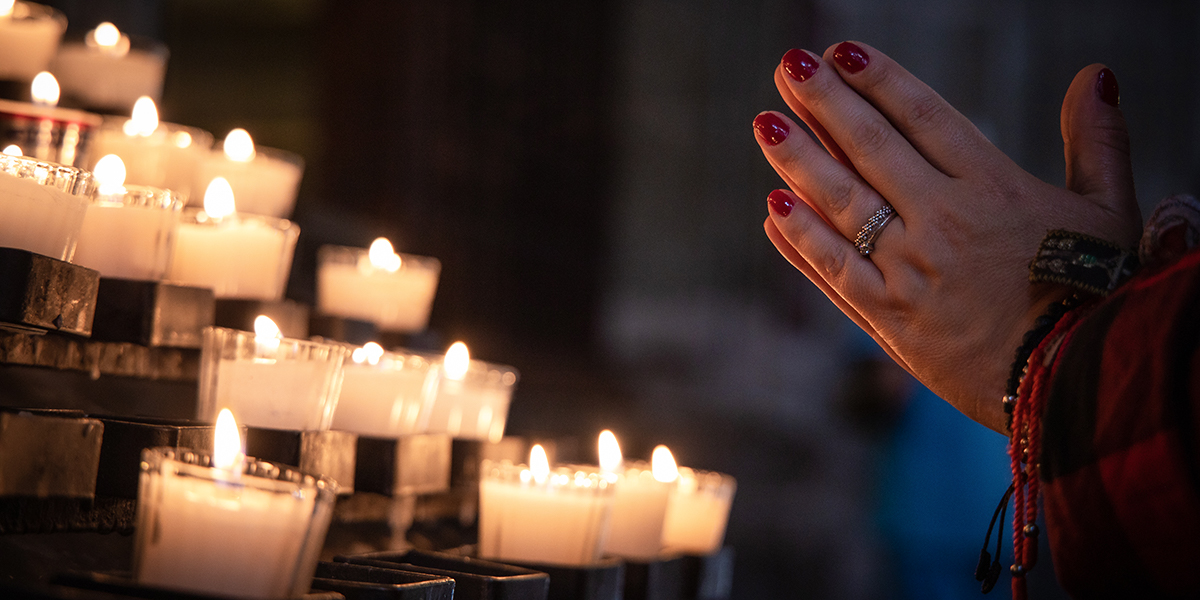 Why do Catholics light candles for the dead?