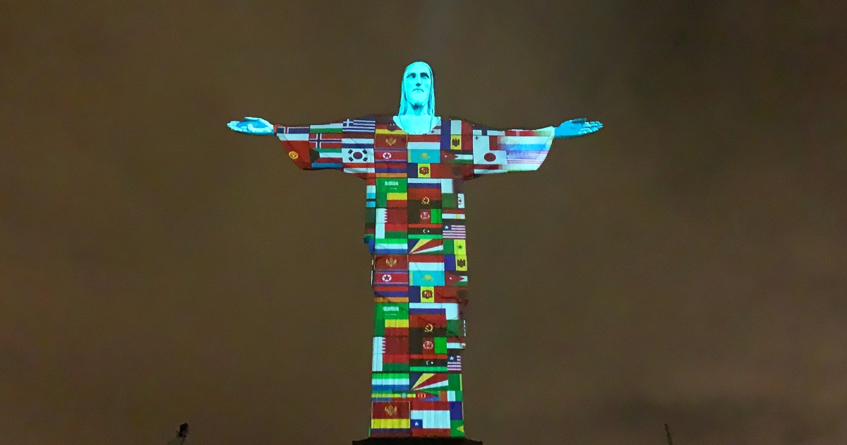 Brazil’s Christ the Redeemer is lit with the flags of countries