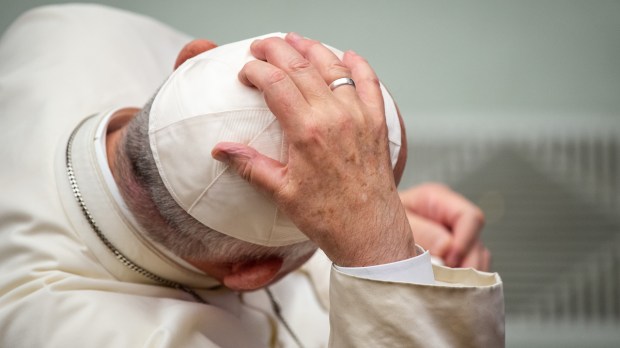 pope zucchetto hat cap hand head close up