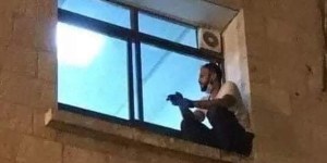 Young man in Palestine scales hospital wall every night to watch over his dying mom