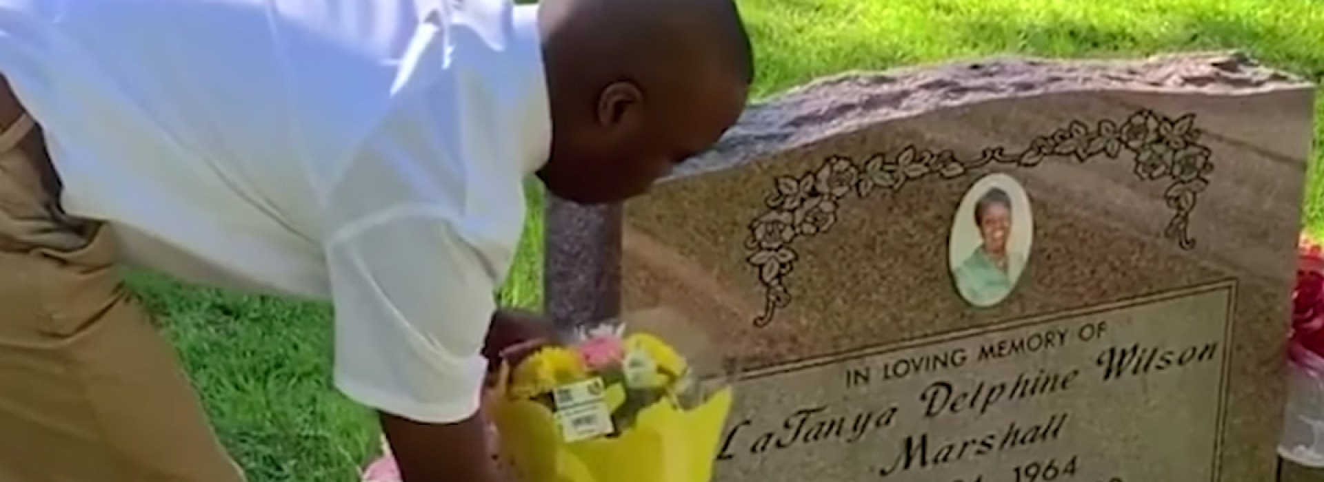 CHILD VISITING MOTHER'S GRAVE