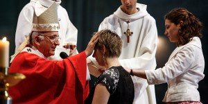 What are the sacraments of initiation in the Catholic Church?