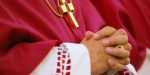 BISHOP PRAYING