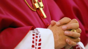 BISHOP PRAYING