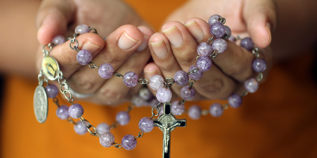 The perfect gifts for Catholic converts joining the church this Easter 2 web3-rosary-pray-prayer-hands-hold-shutterstock_1400757953.jpg